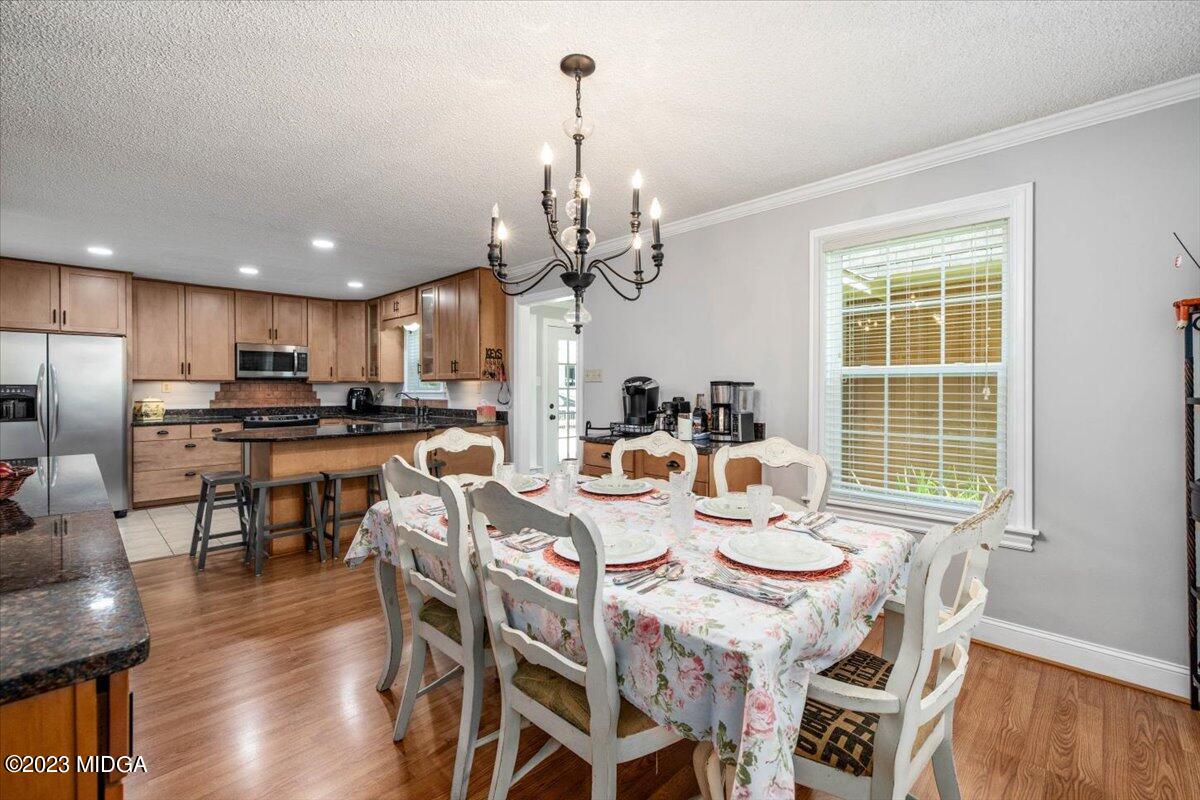 222 Red Oak Road Byron, GA 31008 - Photo 11 of 38 a view of a dining room with furniture window and wooden floor