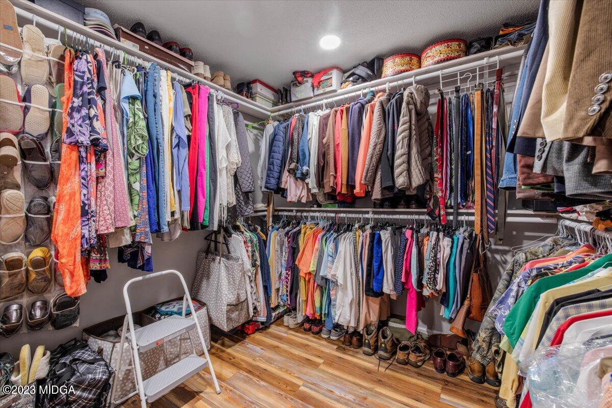 222 Red Oak Road Byron, GA 31008 - Photo 17 of 38 a view of walk in closet with clothes