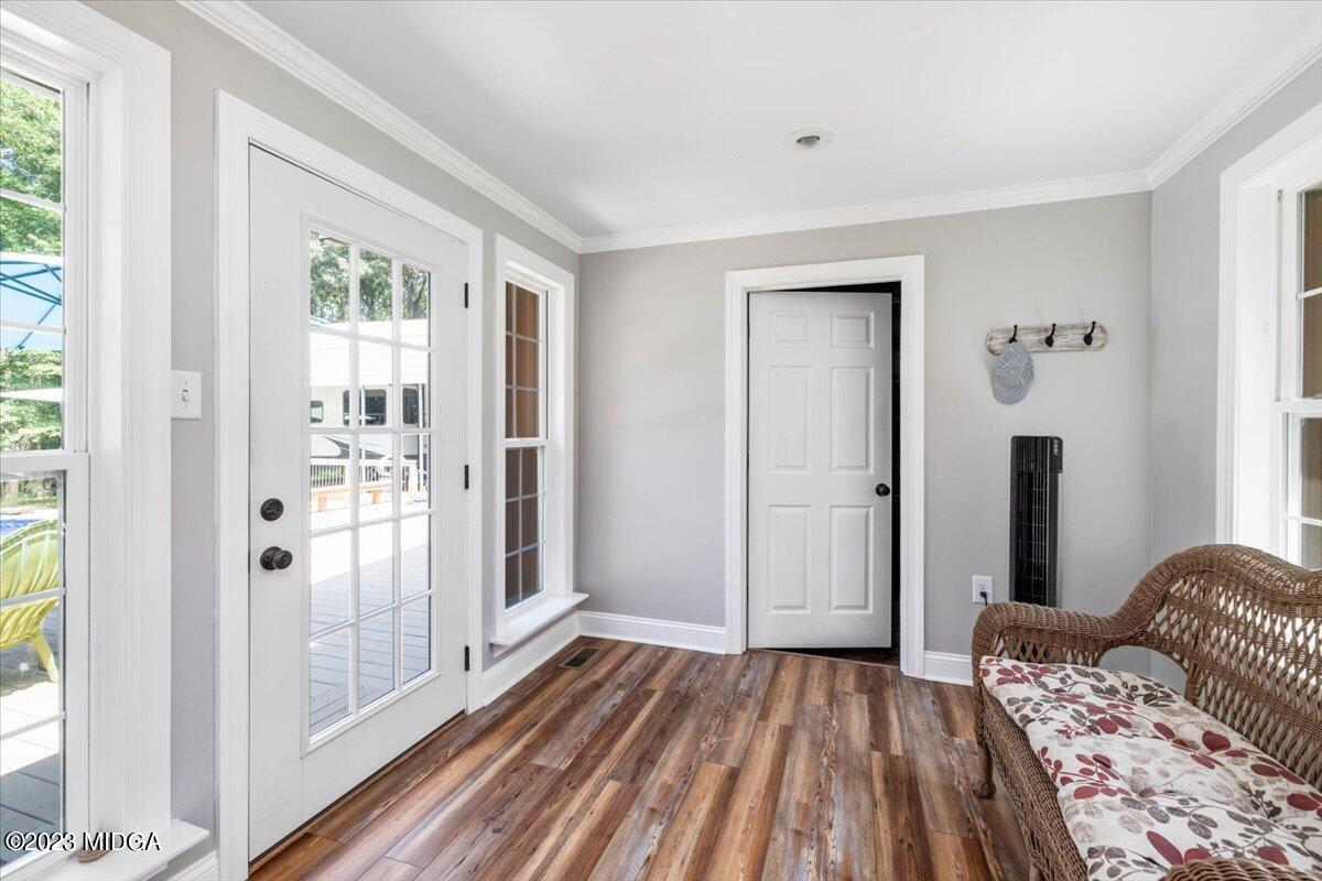 222 Red Oak Road Byron, GA 31008 - Photo 25 of 38 a bedroom with a bed and wooden floor
