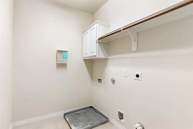 a view of storage and utility room with wooden floor