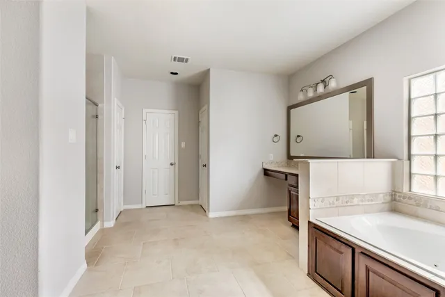 a view of a kitchen cabinets a sink and a refrigerator