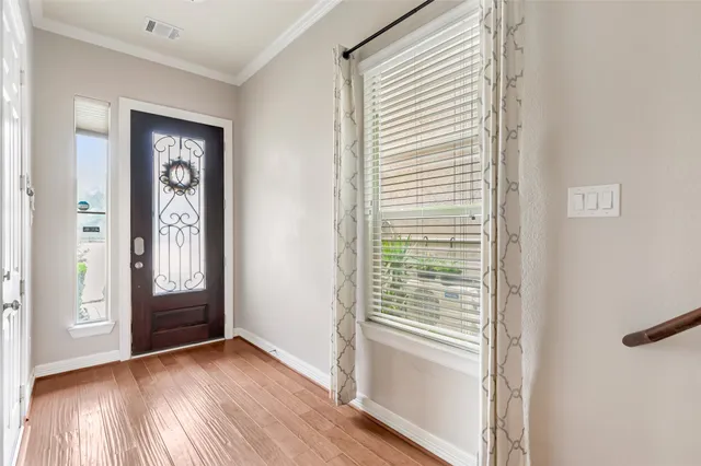 a view of an entryway with a hardwood