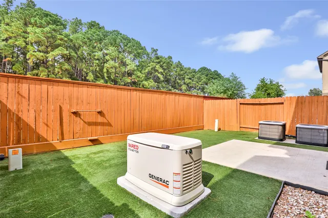 a view of a backyard with sitting area