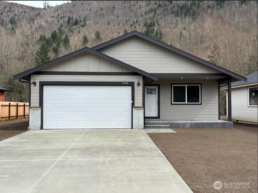 a front view of a house with a garage