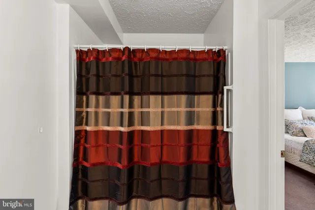 a view of a room with racks on the wall