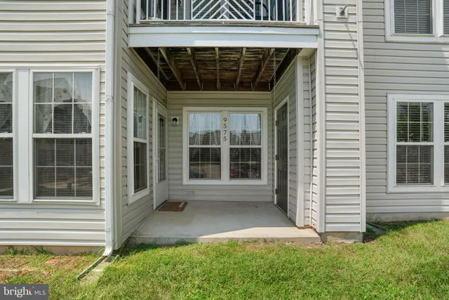 a view of front door of a house with a large window