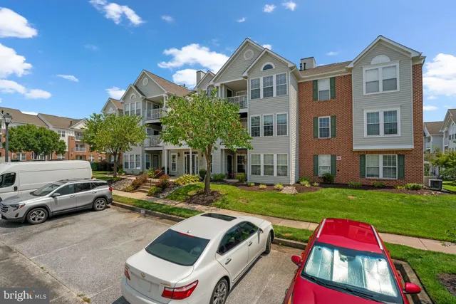 a front view of house with outdoor space and garden