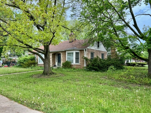 1146 Raleigh Road Glenview, IL 60025 - Photo 2 of 3 a front view of a house with a yard