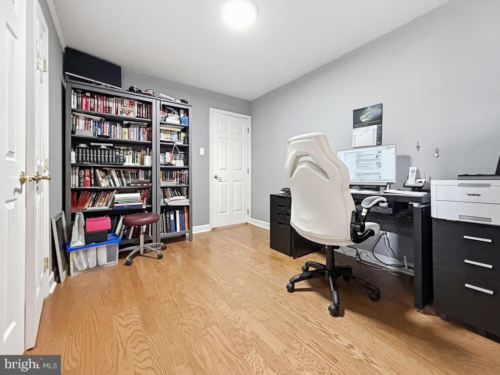 254 Allen Lane Warminster, PA 18974 - Photo 45 of 85 a view of a workspace with furniture and a book shelf