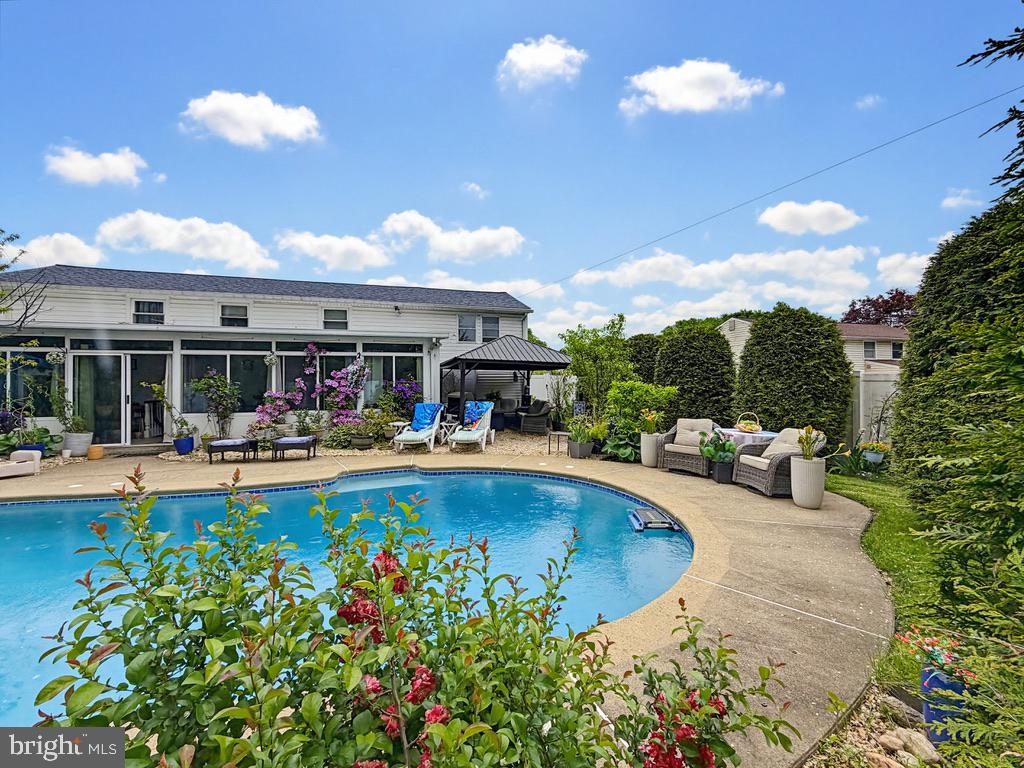 254 Allen Lane Warminster, PA 18974 - Photo 71 of 85 a view of a backyard with swimming pool and furniture