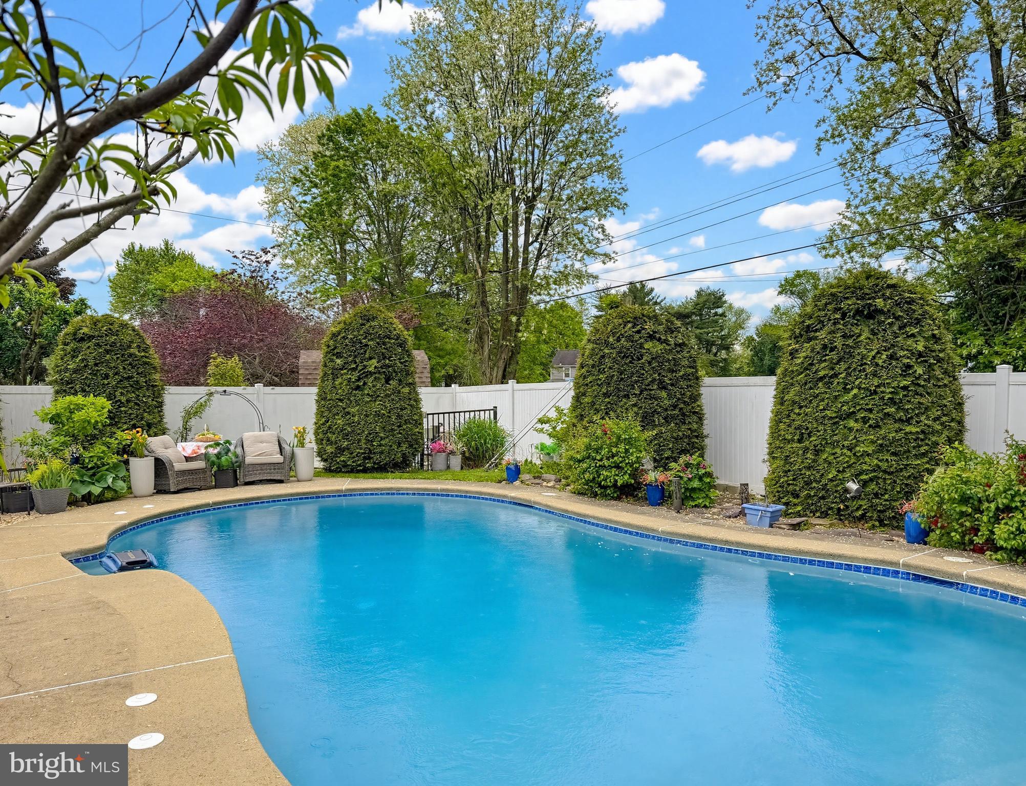 254 Allen Lane Warminster, PA 18974 - Photo 76 of 85 a view of a swimming pool with an outdoor space and seating area
