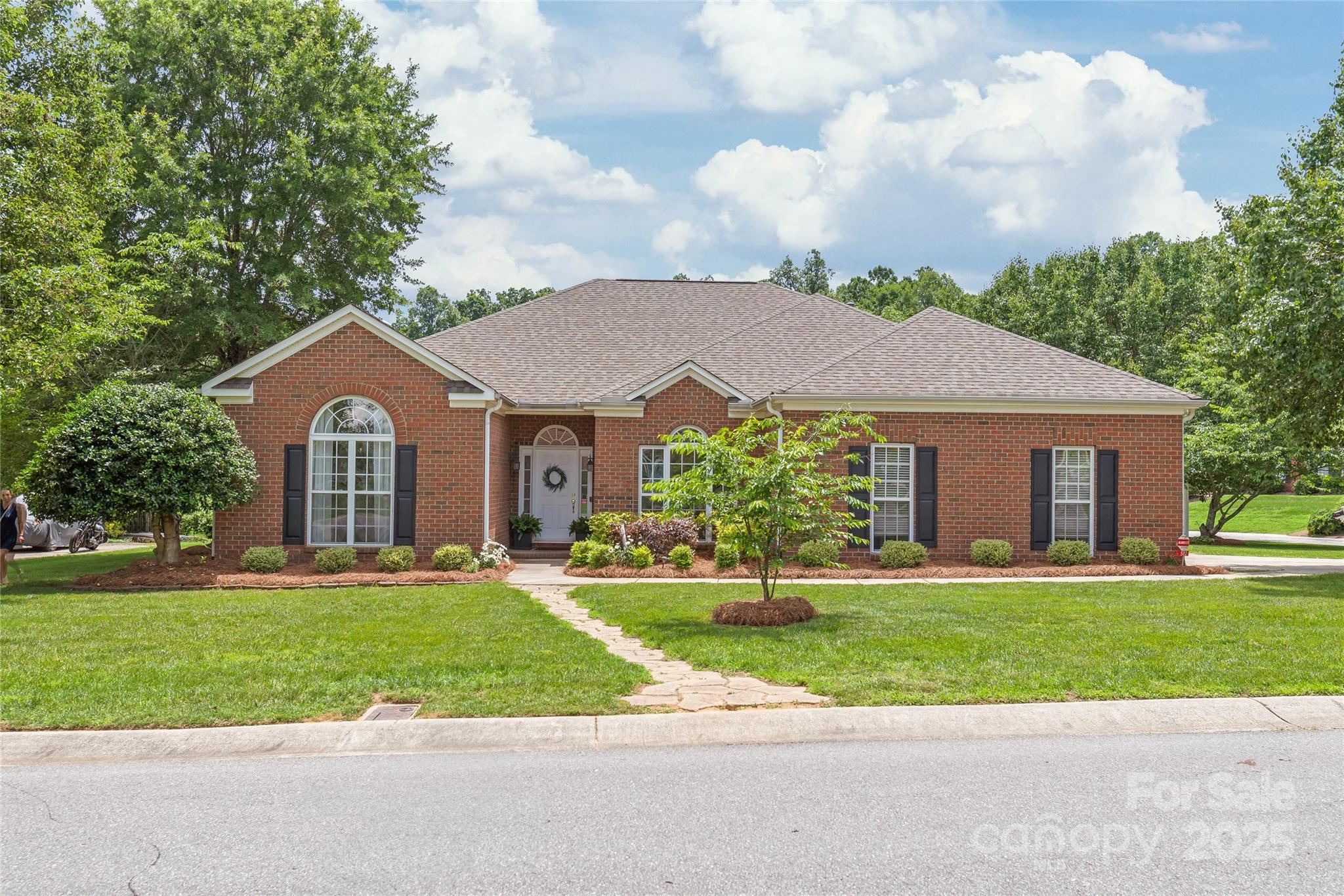 502 Roxanne Court Northwest Concord, NC 28027 - Photo 1 of 40 a front view of a house with a yard and garage