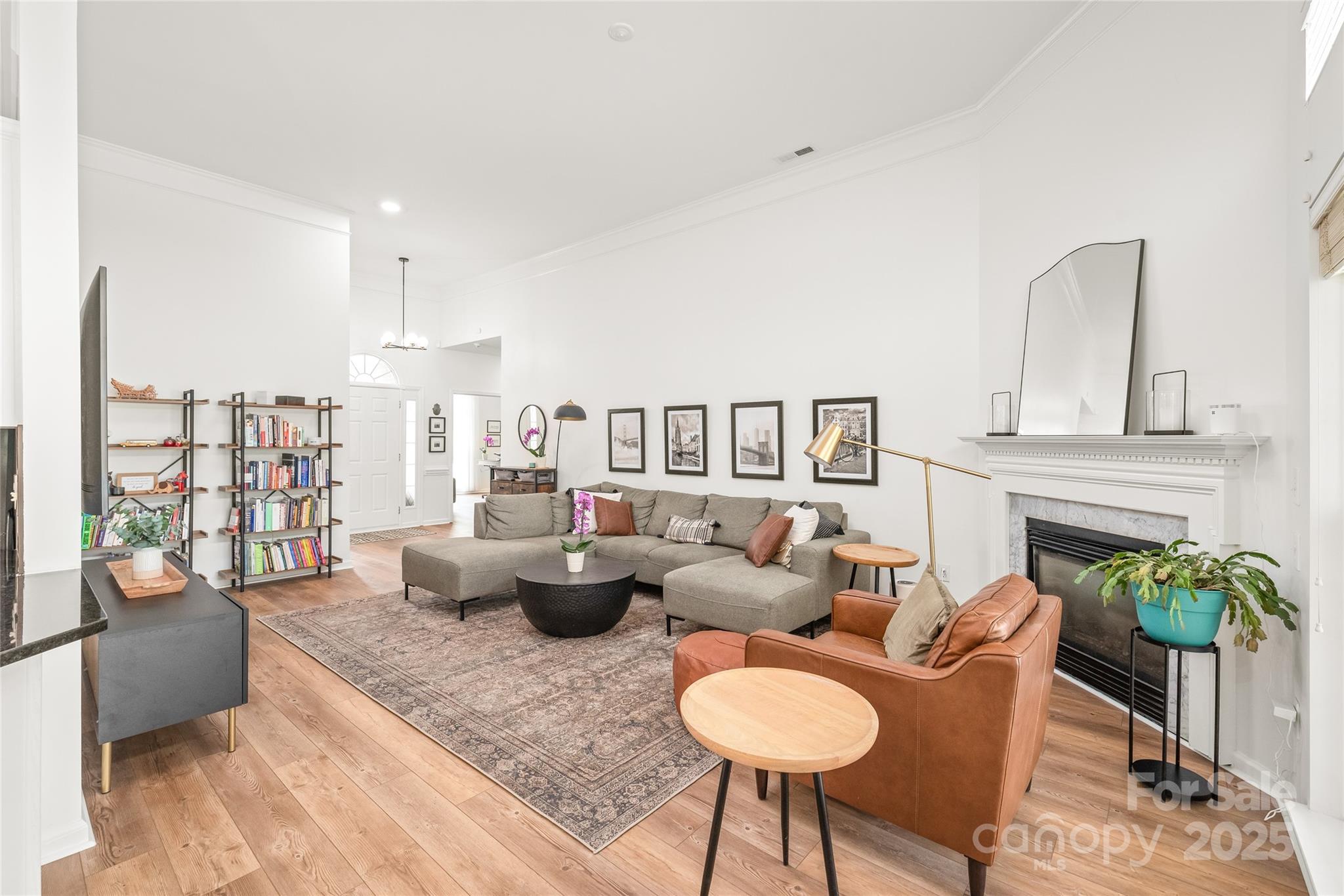 502 Roxanne Court Northwest Concord, NC 28027 - Photo 11 of 40 a living room with furniture potted plant and a fireplace