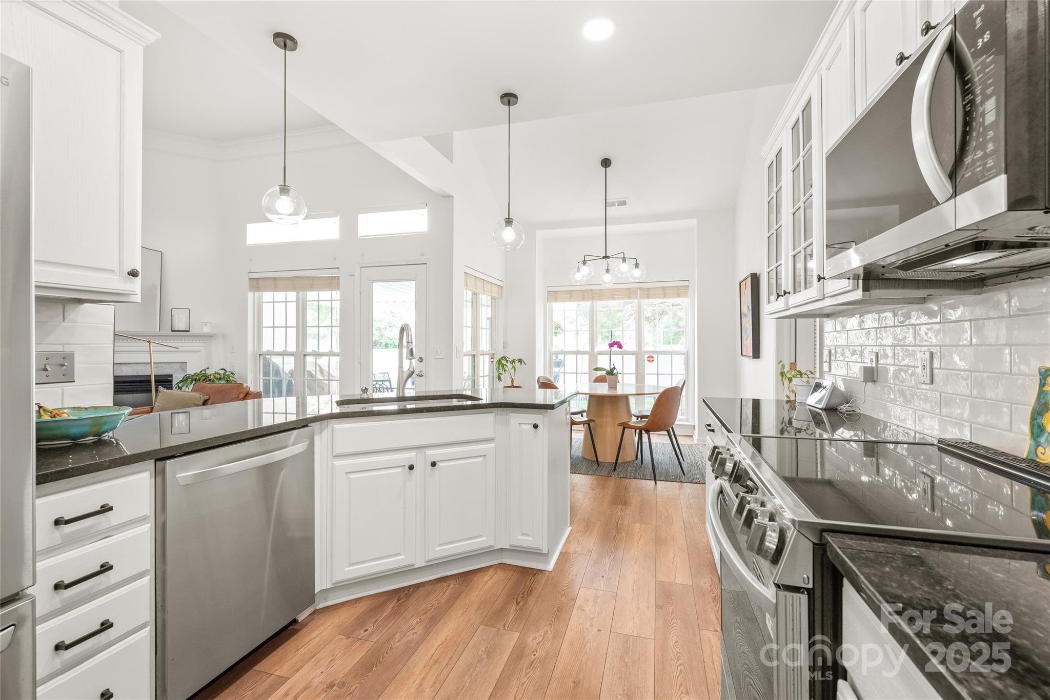 502 Roxanne Court Northwest Concord, NC 28027 - Photo 18 of 40 a kitchen with counter top space a sink appliances and cabinets