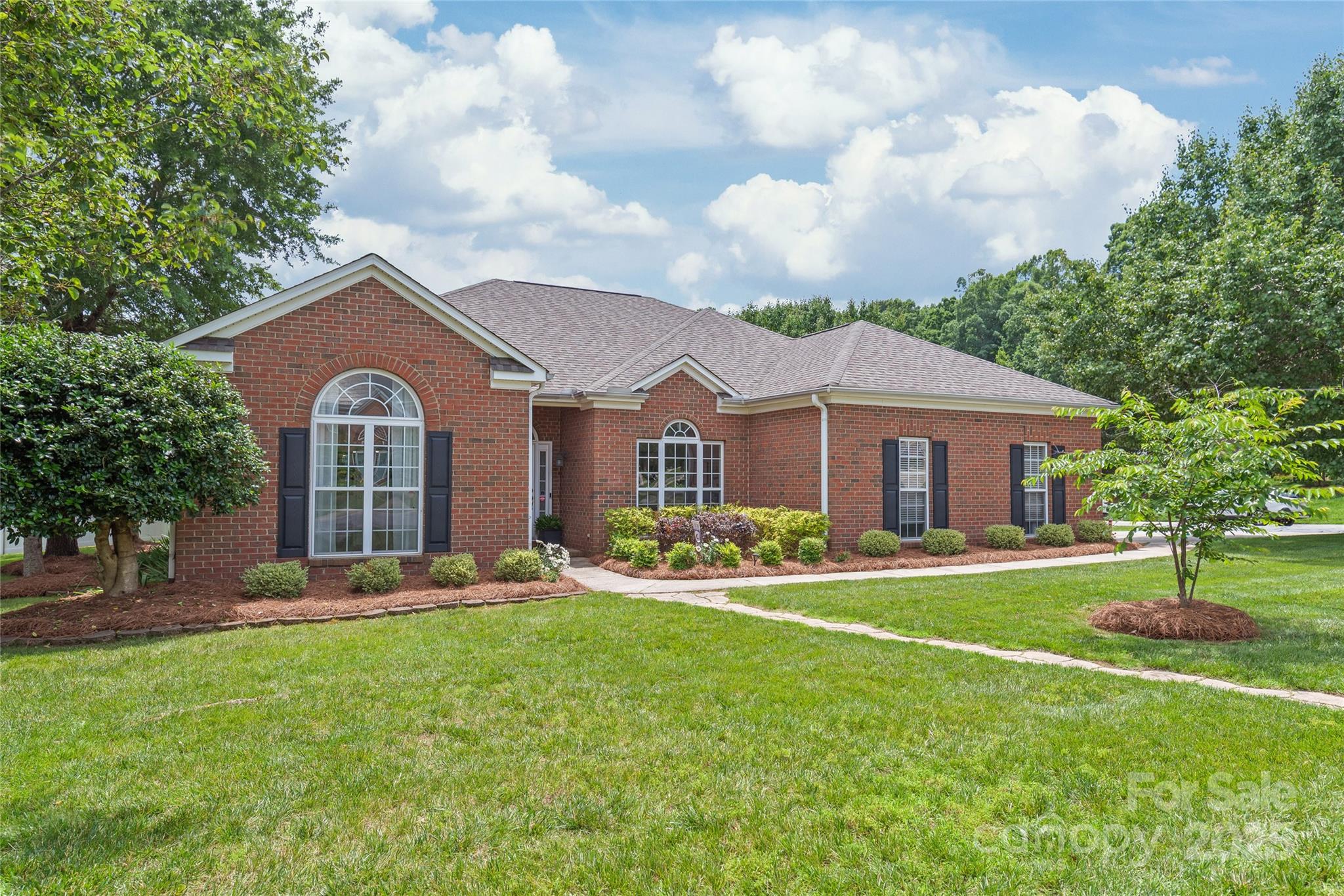 502 Roxanne Court Northwest Concord, NC 28027 - Photo 2 of 40 a front view of a house with a yard and trees