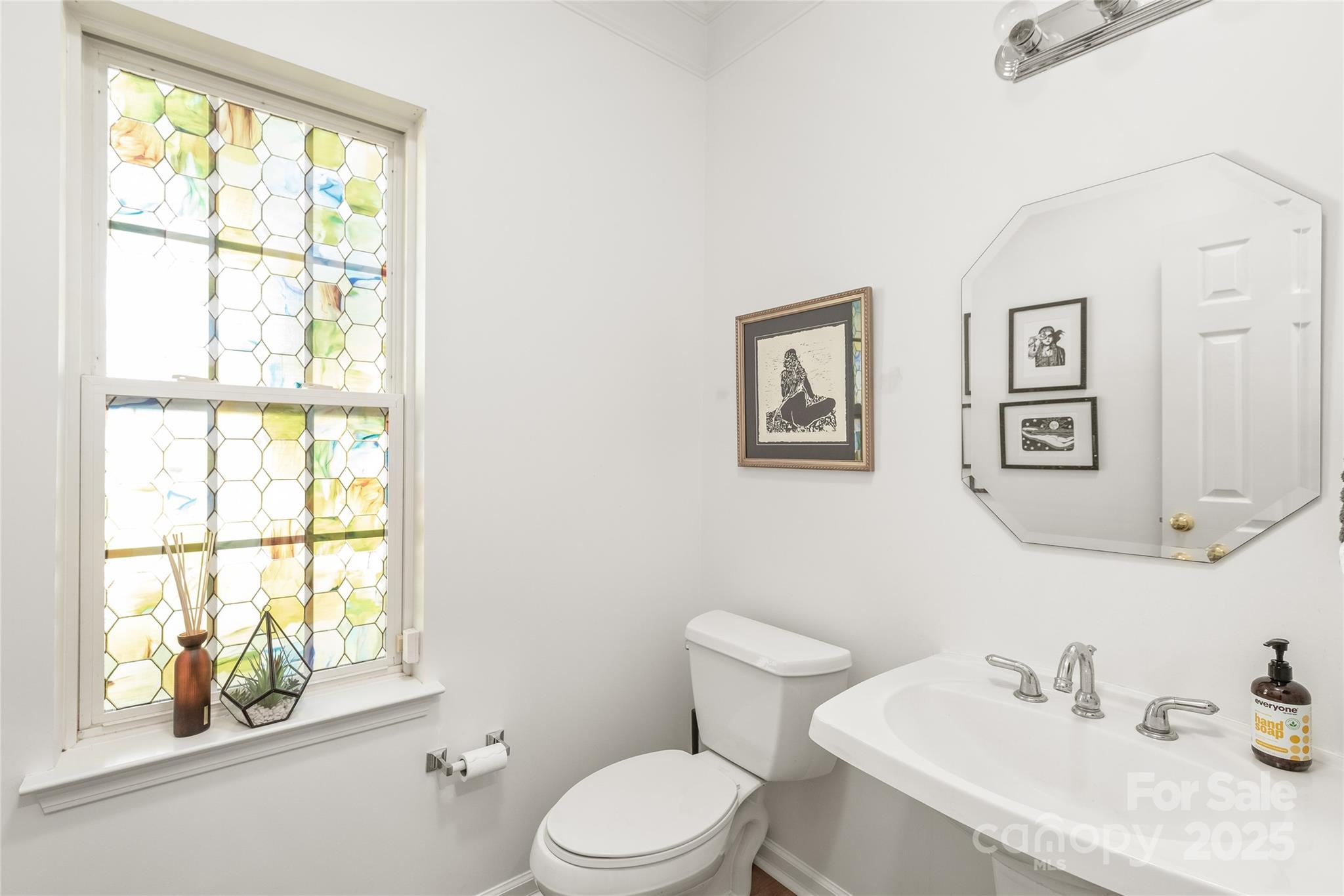 502 Roxanne Court Northwest Concord, NC 28027 - Photo 22 of 40 a white toilet sitting next to a bathroom sink