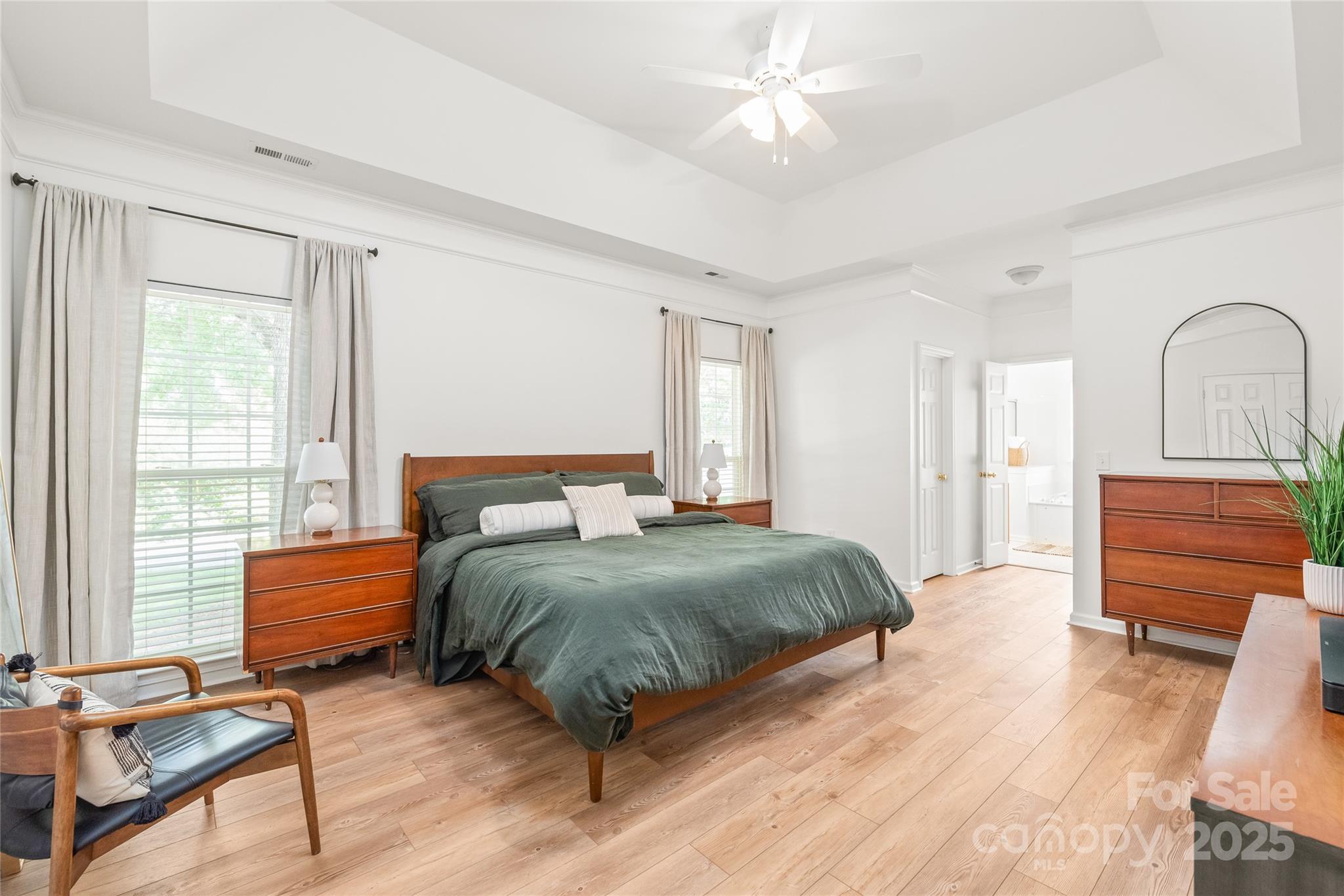 502 Roxanne Court Northwest Concord, NC 28027 - Photo 23 of 40 a bedroom with a bed and wooden floor