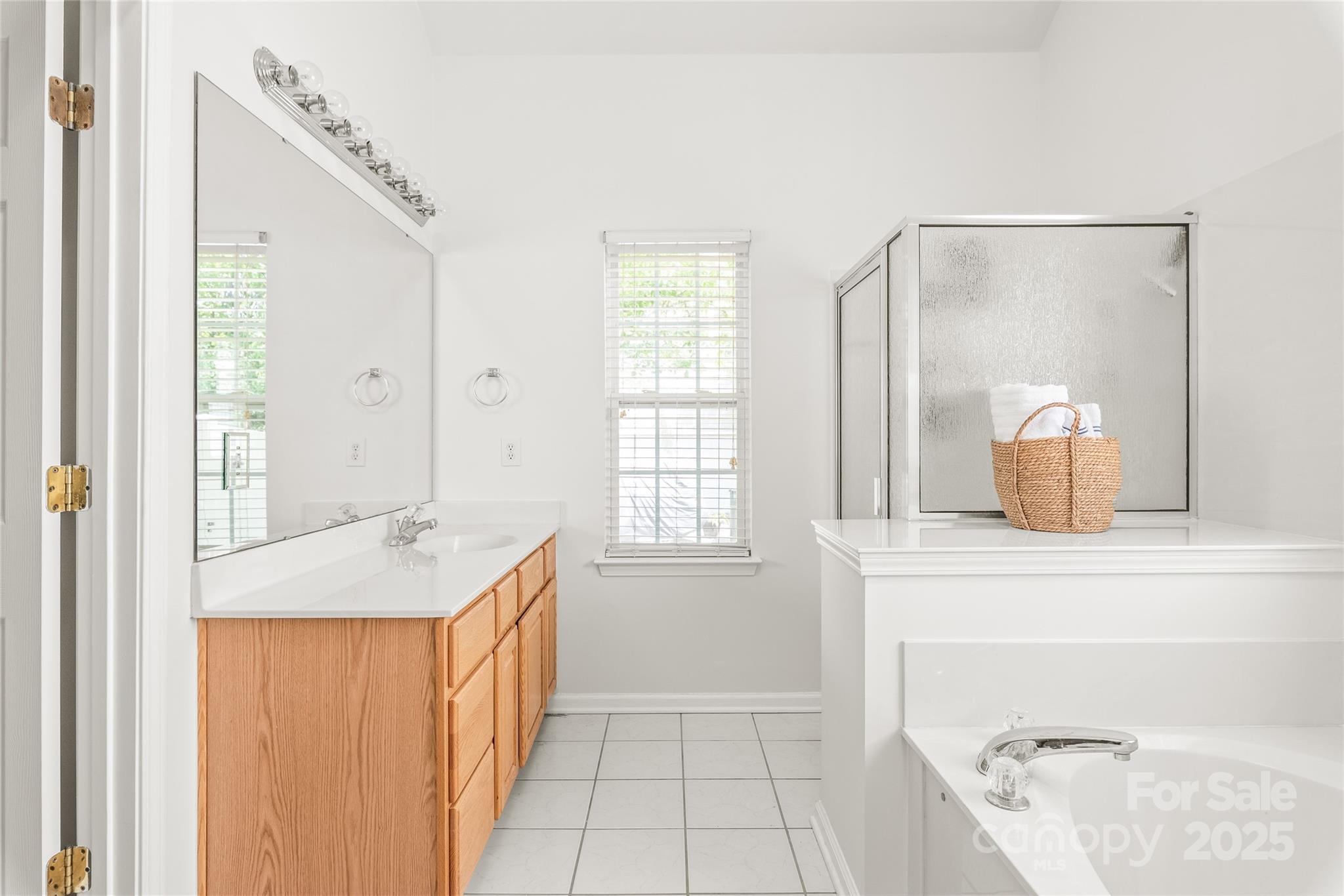 502 Roxanne Court Northwest Concord, NC 28027 - Photo 27 of 40 a en suite bathroom with a granite countertop sink and a mirror