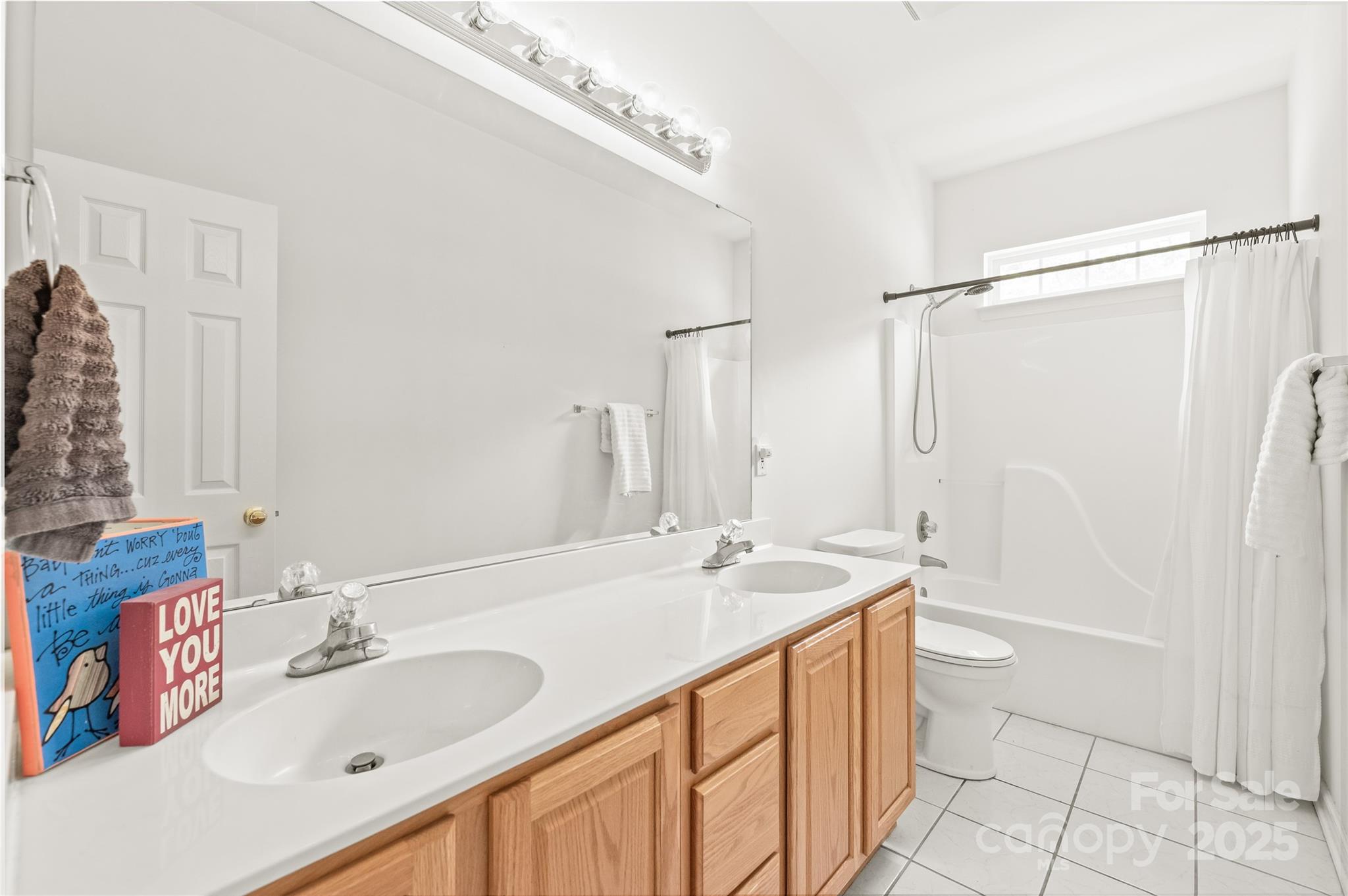 502 Roxanne Court Northwest Concord, NC 28027 - Photo 29 of 40 a bathroom with a sink double vanity and a bathtub