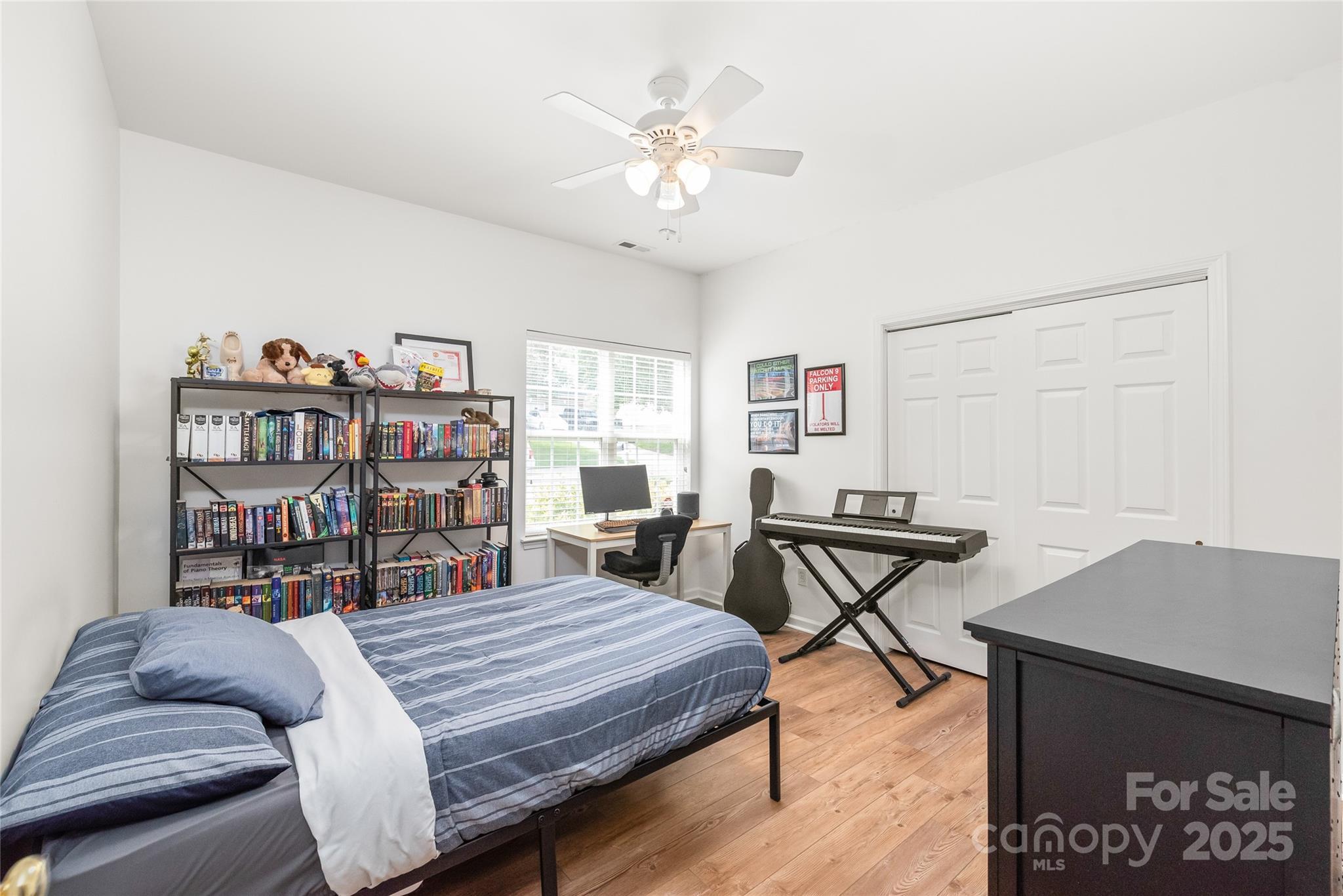 502 Roxanne Court Northwest Concord, NC 28027 - Photo 30 of 40 a bedroom with furniture and a book shelf