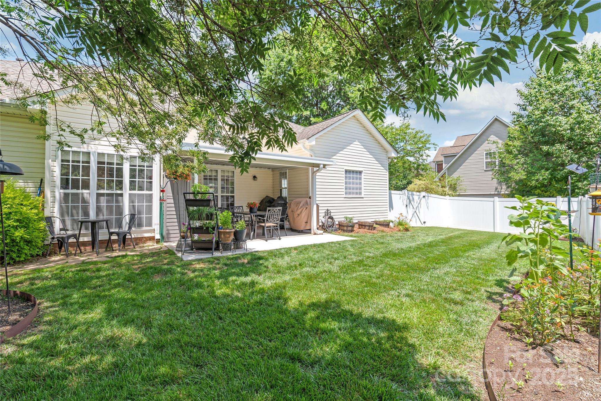 502 Roxanne Court Northwest Concord, NC 28027 - Photo 37 of 40 a view of backyard of house with outdoor seating and green space
