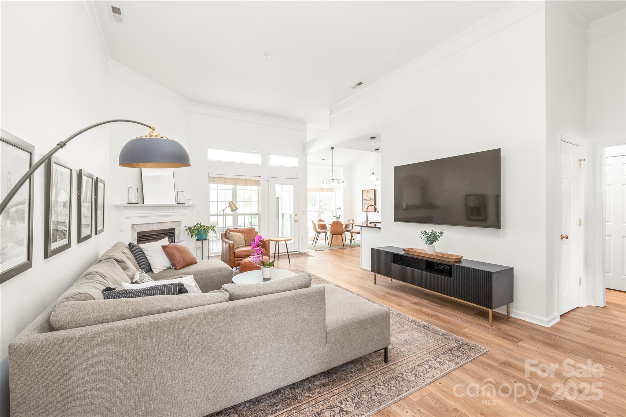 502 Roxanne Court Northwest Concord, NC 28027 - Photo 8 of 40 a living room with furniture and a flat screen tv