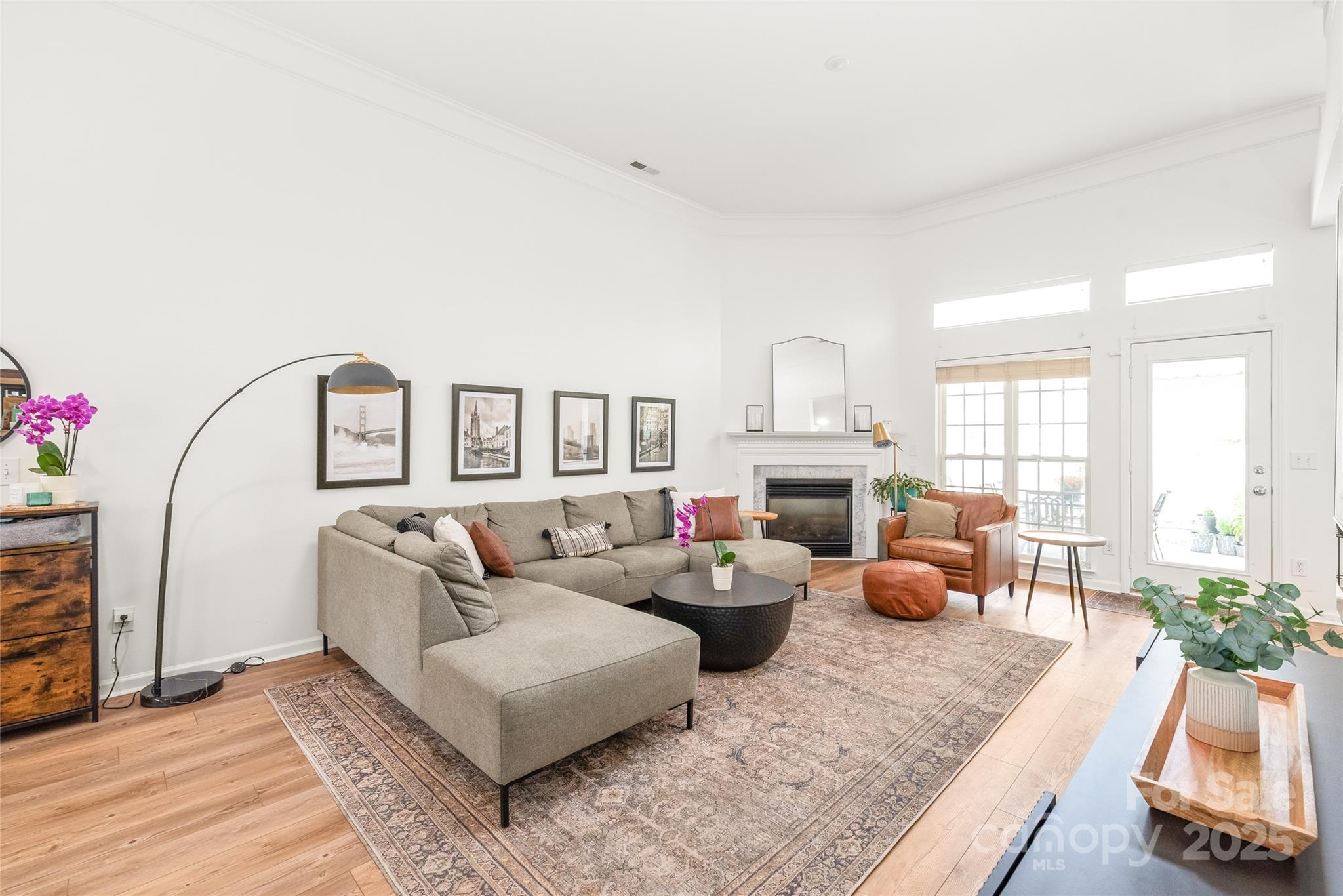 502 Roxanne Court Northwest Concord, NC 28027 - Photo 9 of 40 a living room with furniture large window and a fireplace