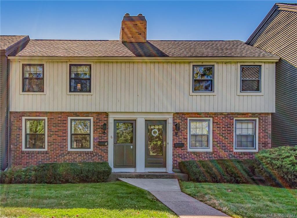 4 Spring Street, Unit 4 Wethersfield, CT 06109 - Photo 1 of 1 a front view of a house with garden