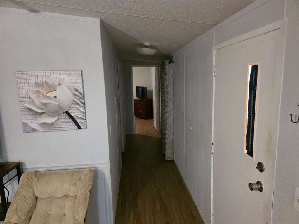 115 Yates Circle Aledo, TX 76008 - Photo 22 of 31 a view of a hallway with paintings on the wall