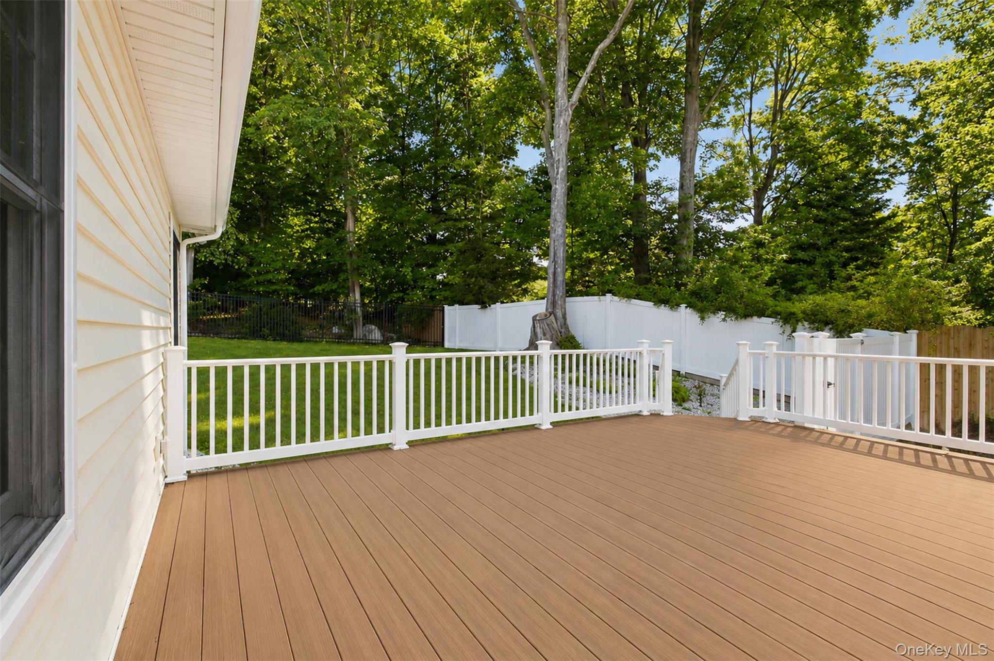 12 Leeside Road Carmel, NY 10512 - Photo 34 of 44 Expansive outdoor deck featuring wood-finish flooring and white railings