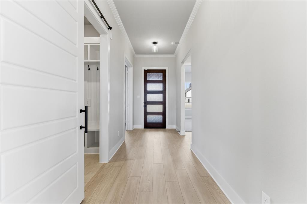 245 Cobb Road Leonard, TX 75452 - Photo 16 of 30 a view of a hallway with wooden floor and closet