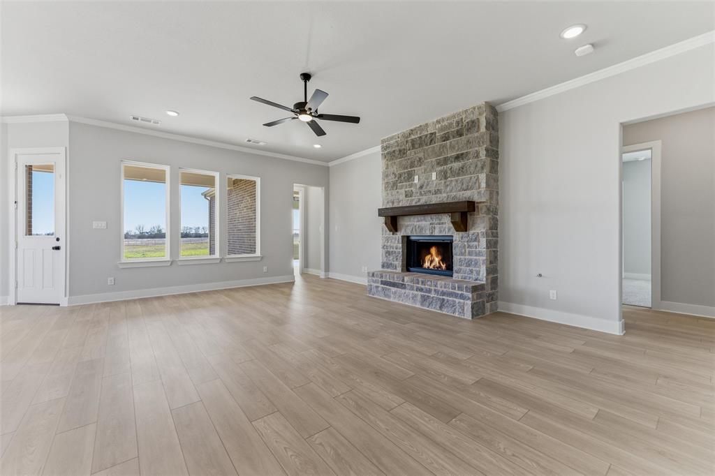 245 Cobb Road Leonard, TX 75452 - Photo 18 of 30 a view of an empty room with a fireplace and a window