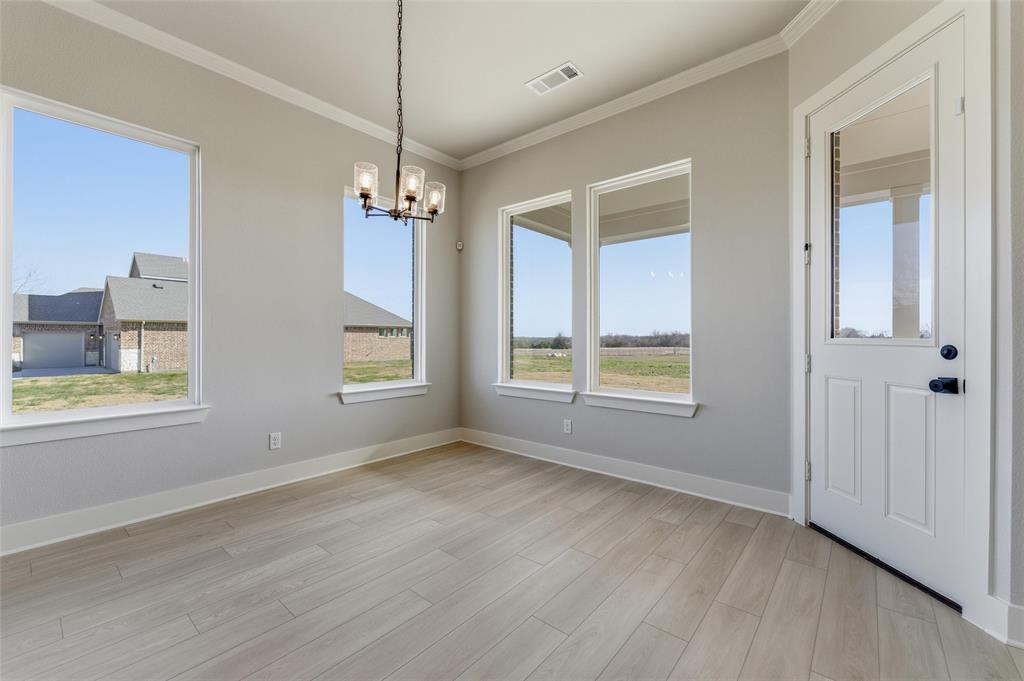 245 Cobb Road Leonard, TX 75452 - Photo 21 of 30 a view of an empty room with a window and wooden floor