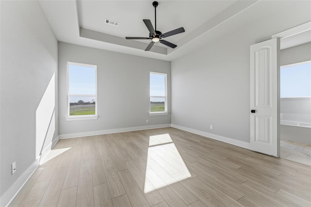 245 Cobb Road Leonard, TX 75452 - Photo 23 of 30 a view of empty room with wooden floor and fan