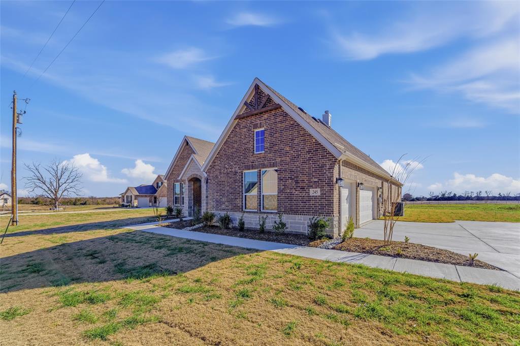 245 Cobb Road Leonard, TX 75452 - Photo 3 of 30 a view of a house with a yard and a large tree