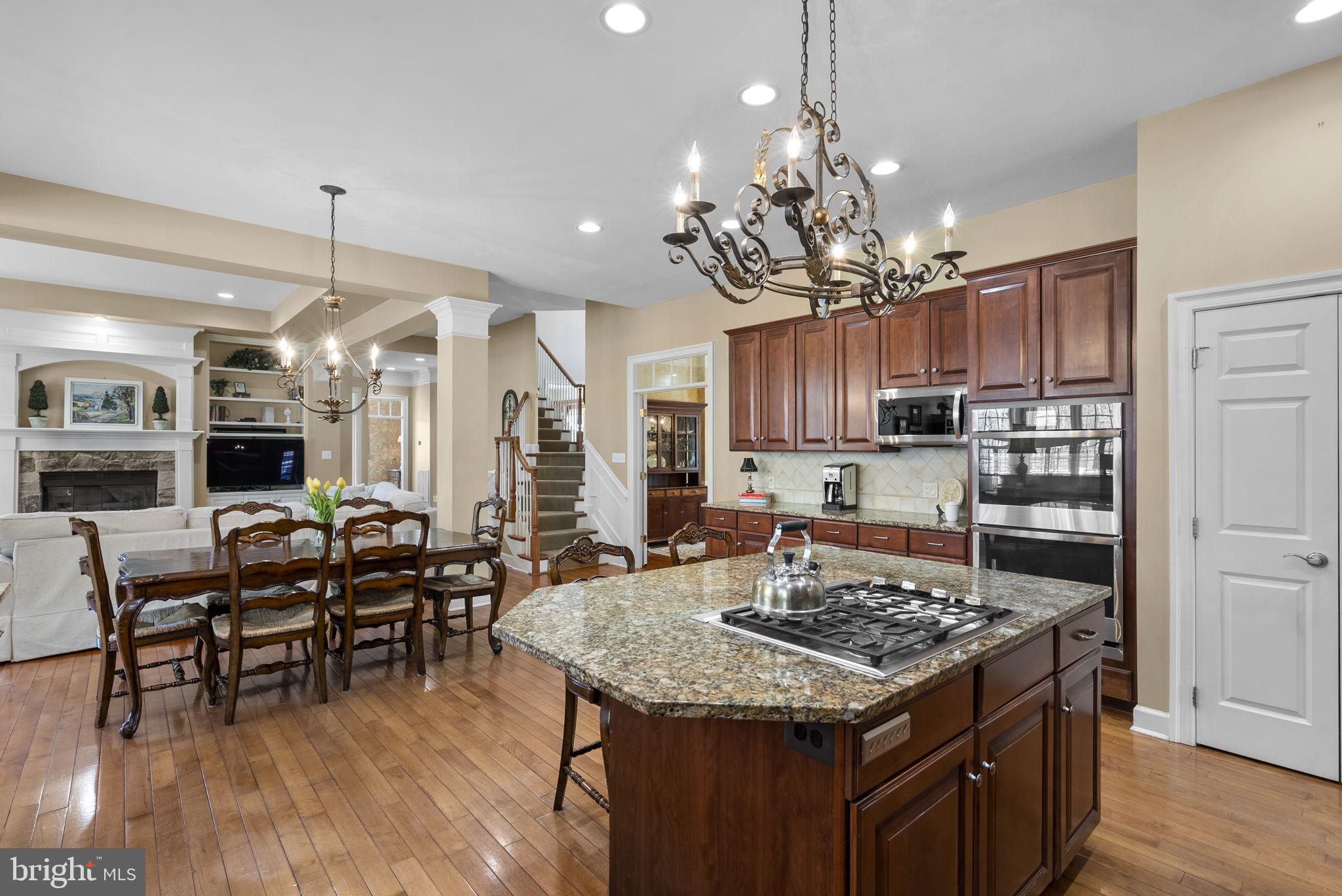 17516 Ashton Green Drive Sandy Spring, MD 20860 - Photo 25 of 60 a kitchen with a table and chairs in it