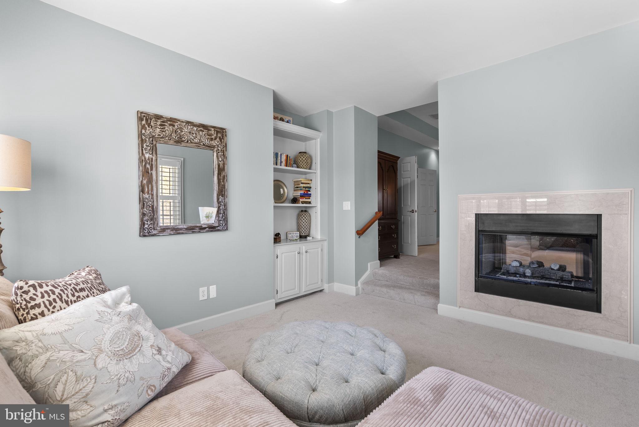 17516 Ashton Green Drive Sandy Spring, MD 20860 - Photo 40 of 60 a living room with furniture and a fireplace