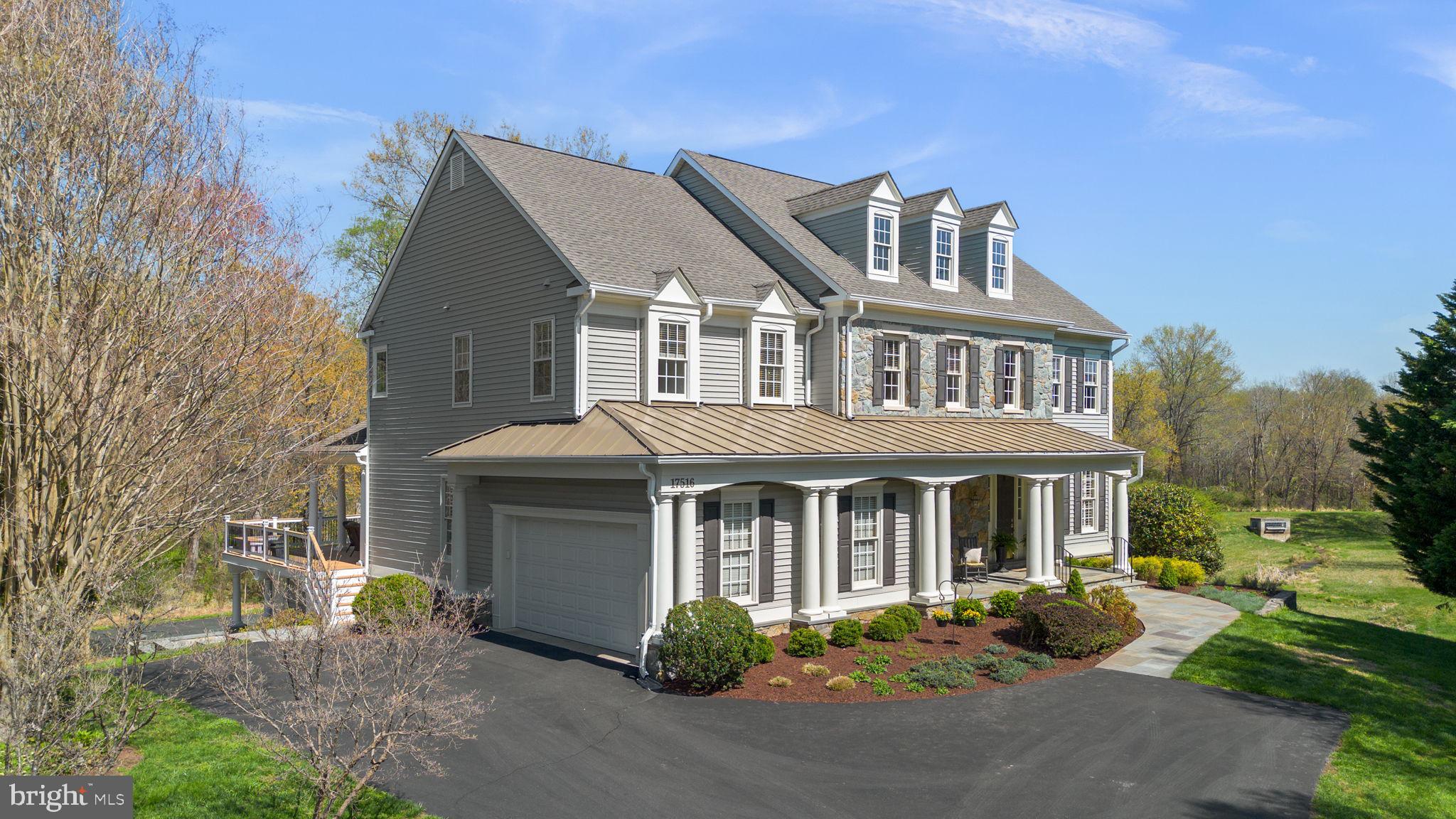 17516 Ashton Green Drive Sandy Spring, MD 20860 - Photo 4 of 60 a front view of a house with garden