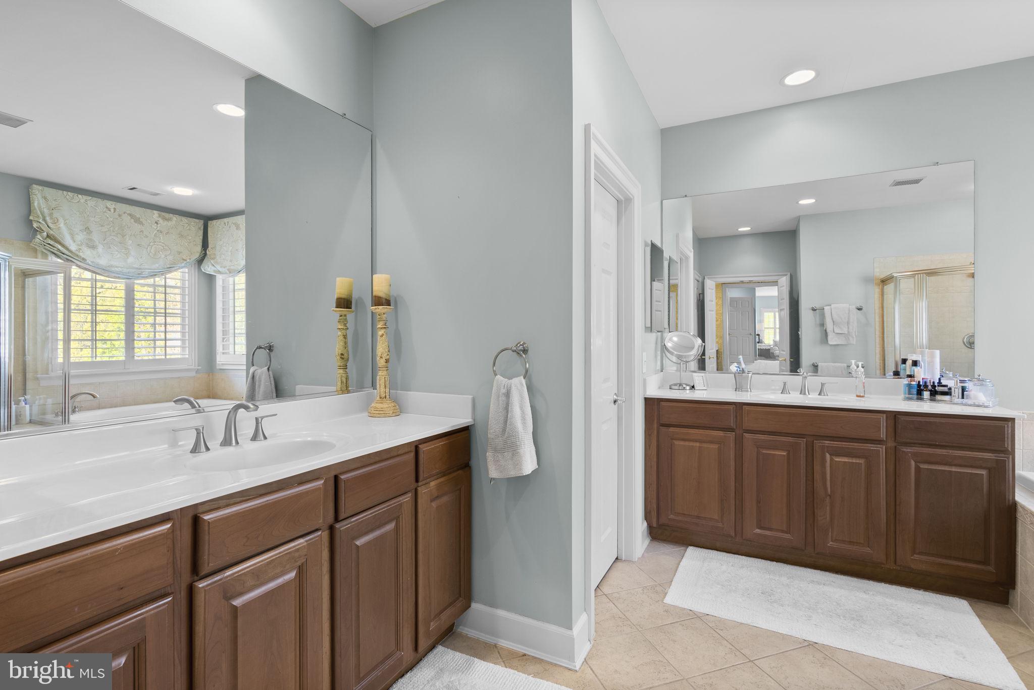 17516 Ashton Green Drive Sandy Spring, MD 20860 - Photo 44 of 60 a spacious bathroom with a double vanity sink mirror and double