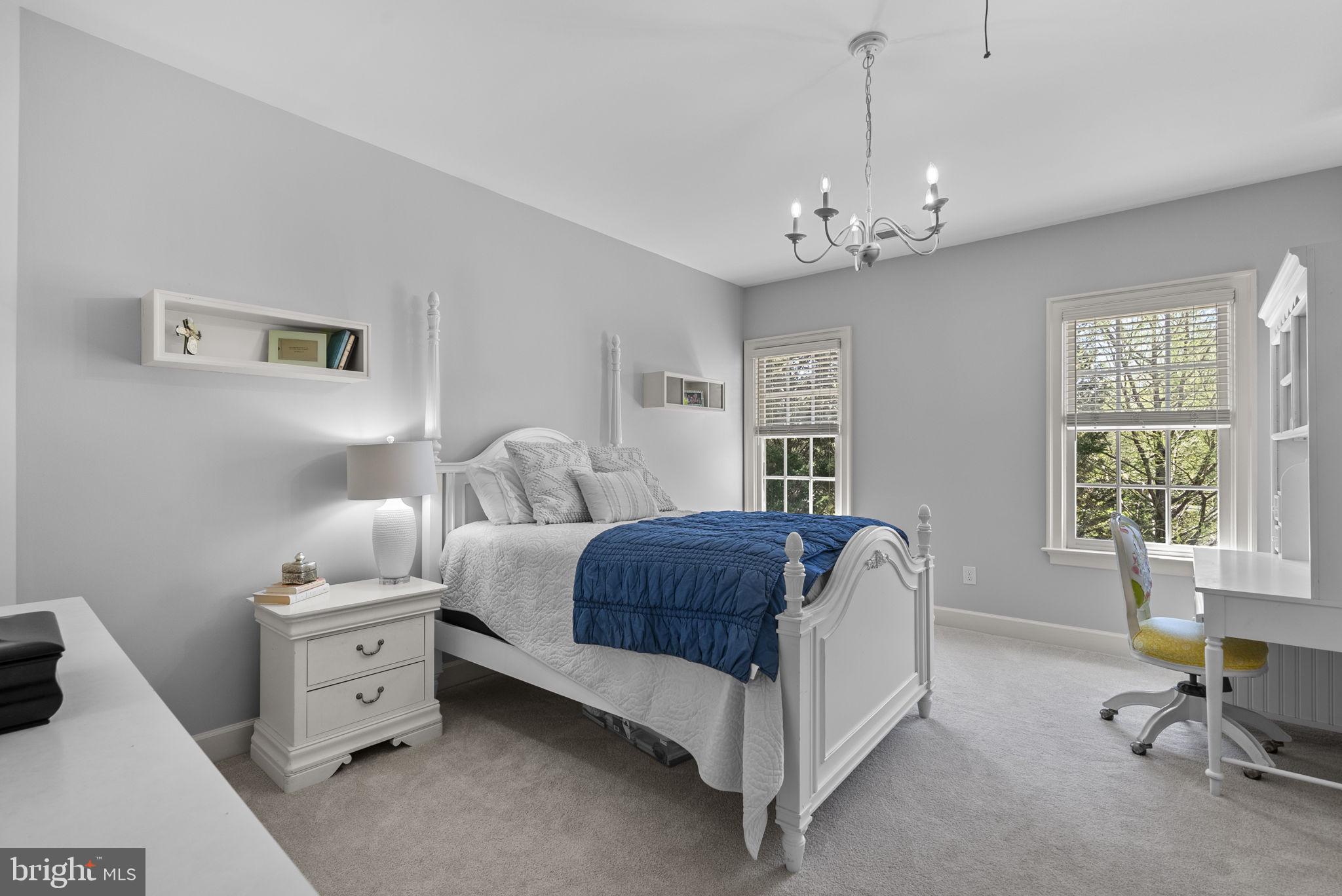 17516 Ashton Green Drive Sandy Spring, MD 20860 - Photo 53 of 60 a spacious bedroom with a bed and a window