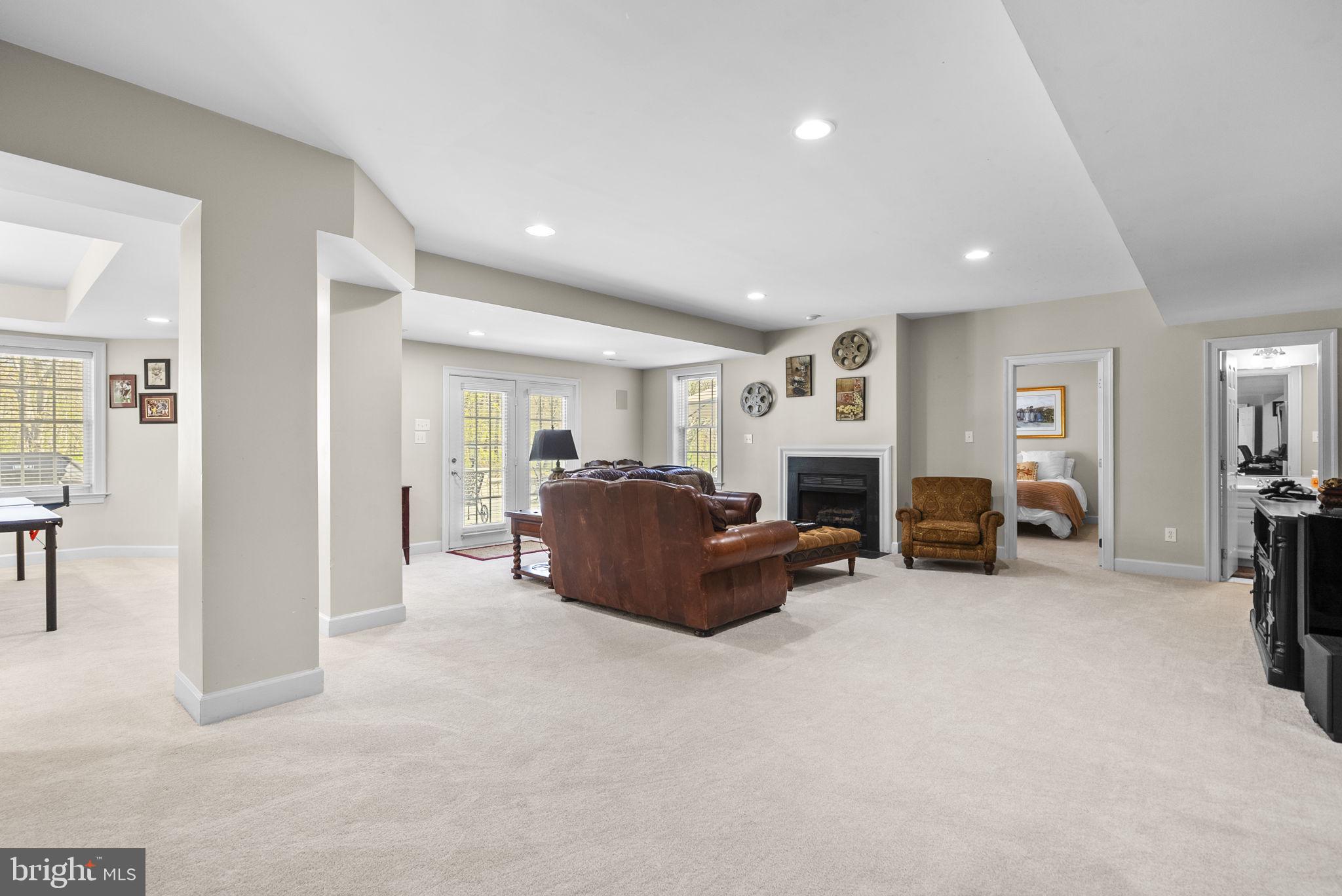 17516 Ashton Green Drive Sandy Spring, MD 20860 - Photo 56 of 60 a living room with furniture and a fireplace