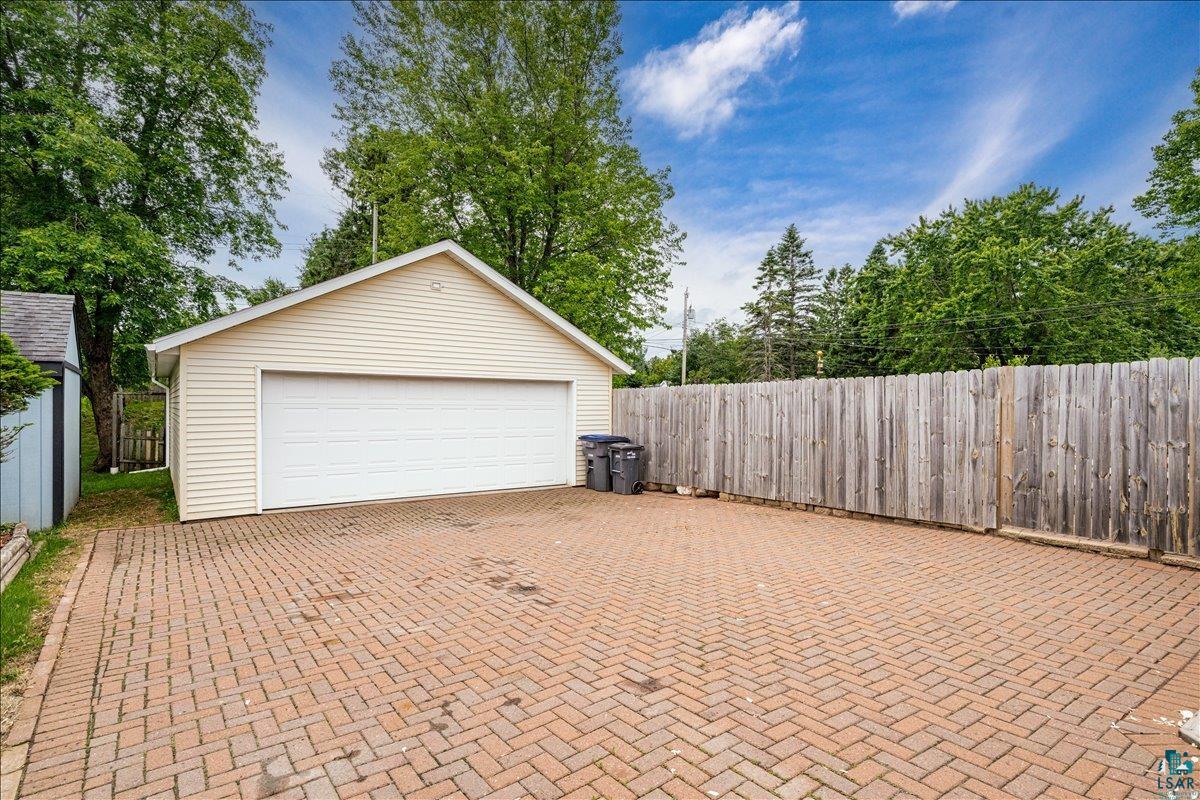130 West Austin Street Duluth, MN 55803 - Photo 27 of 35 Detached garage with horizontal siding and a wide white garage door