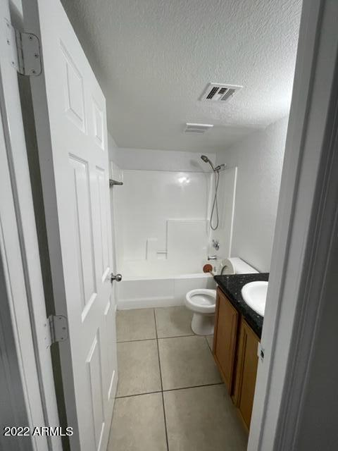 740 West Elm Street, Unit 160 Phoenix, AZ 85013 - Photo 18 of 26 a bathroom with a sink a toilet and shower