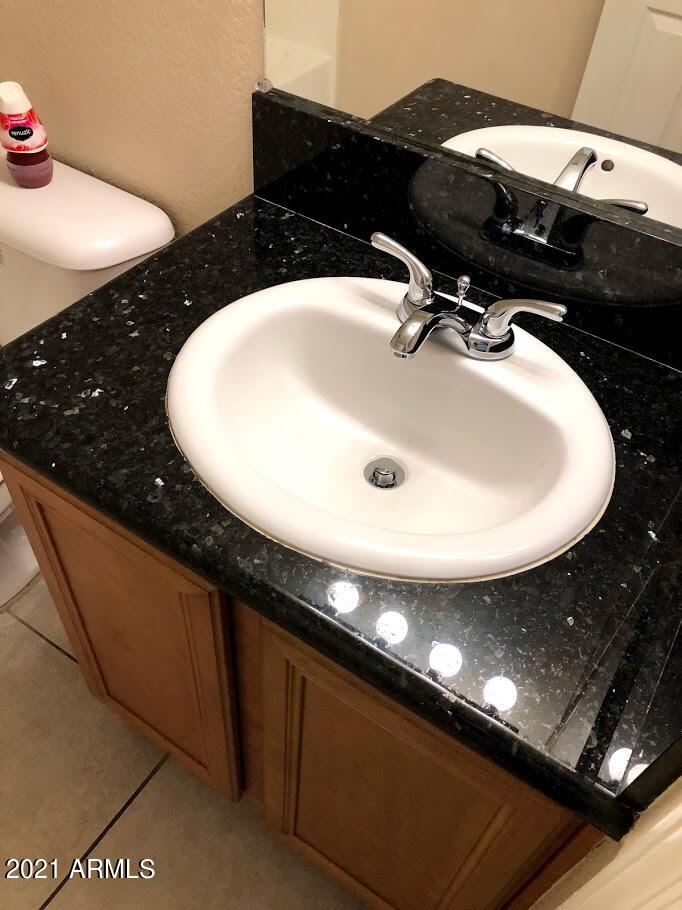 740 West Elm Street, Unit 160 Phoenix, AZ 85013 - Photo 19 of 26 a bathroom with a sink and a mirror