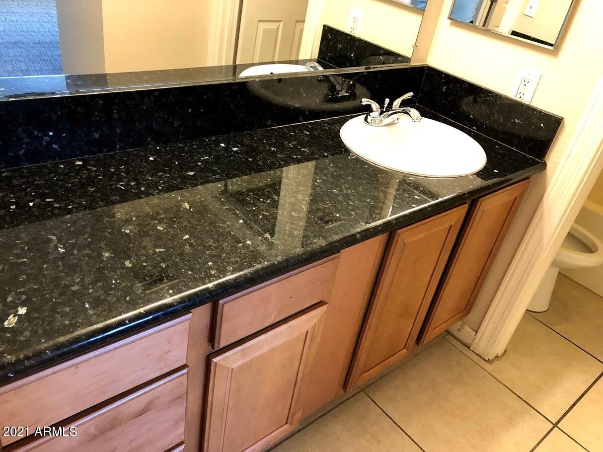 740 West Elm Street, Unit 160 Phoenix, AZ 85013 - Photo 20 of 26 a bathroom with a sink and a mirror