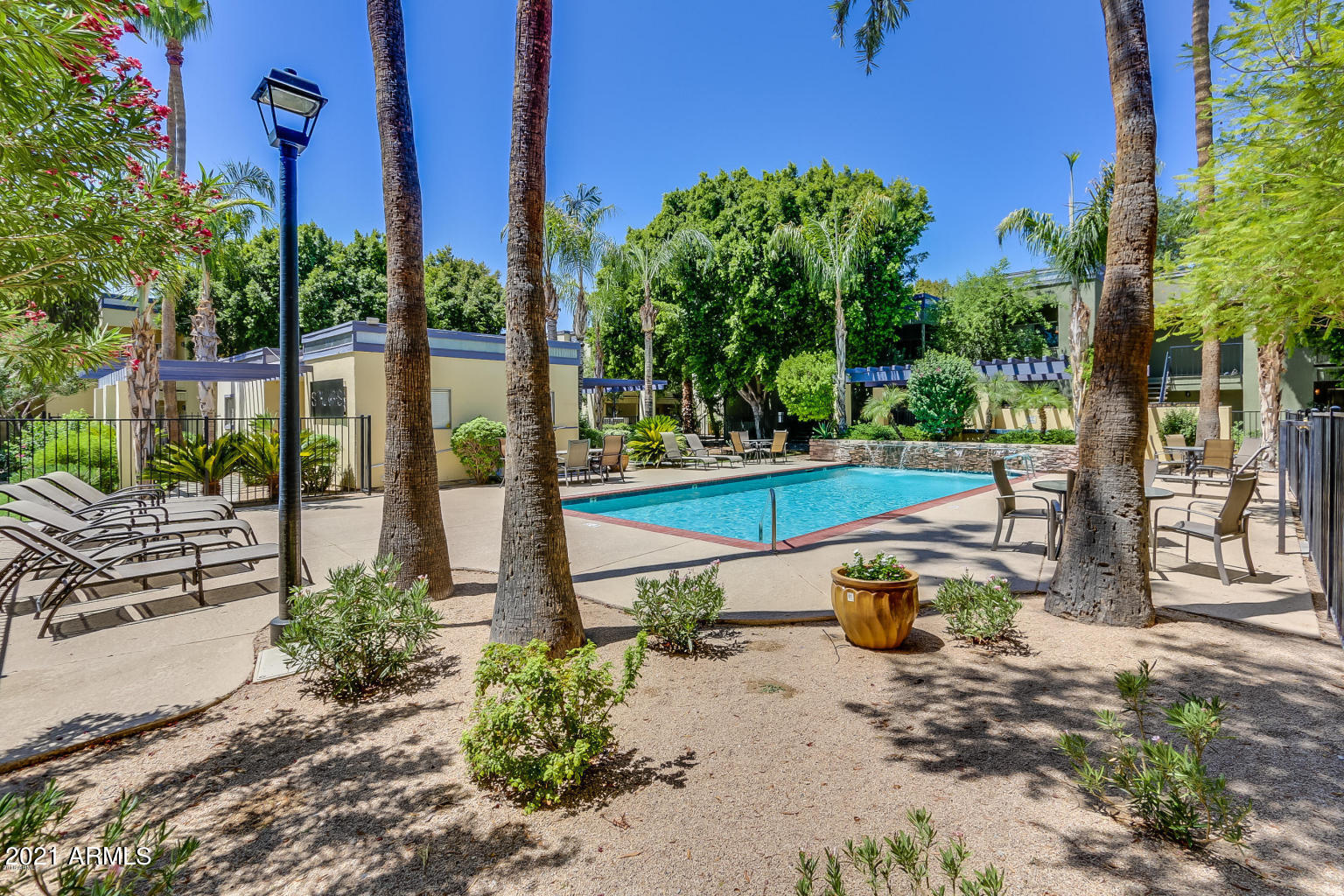 740 West Elm Street, Unit 160 Phoenix, AZ 85013 - Photo 2 of 26 a view of a swimming pool with a patio