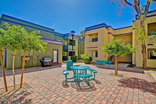 a backyard of a house with seating space