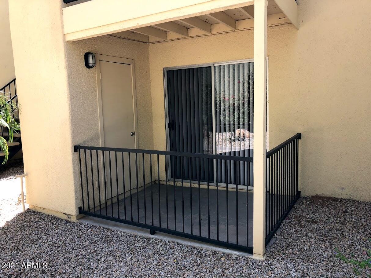 740 West Elm Street, Unit 160 Phoenix, AZ 85013 - Photo 7 of 26 a view of a porch with a door