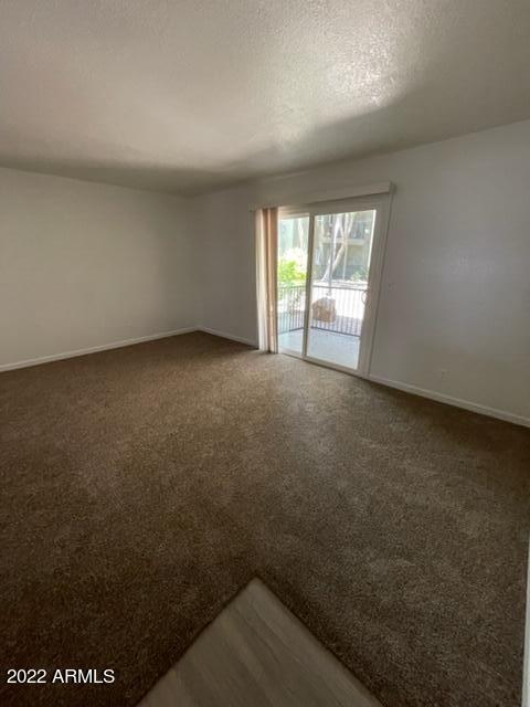 740 West Elm Street, Unit 160 Phoenix, AZ 85013 - Photo 9 of 26 en empty room with windows