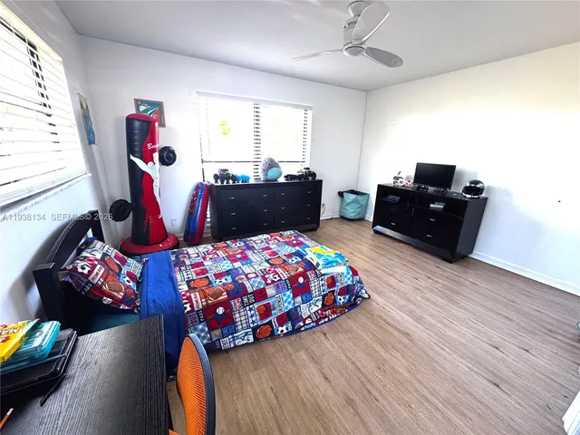 a bedroom with bed and a window